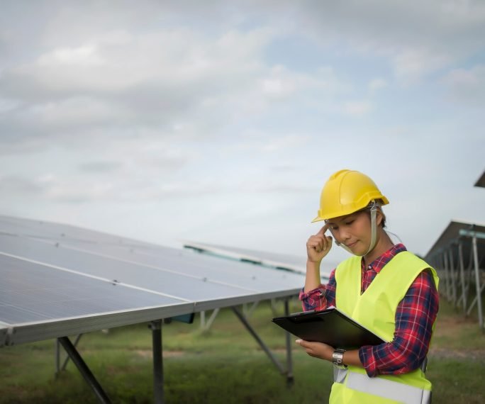 engineer-electric-woman-checking-maintenance-solar-cells_1150-4268